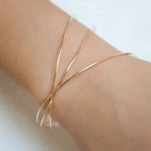 3 joncs fins entrelacés plaqué or